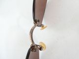 a close up of a pair of sunglasses hanging on a hook