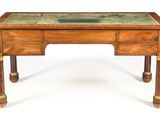 a small wooden desk with a glass top on it