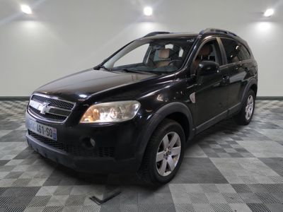 a picture of a black suv parked in a garage