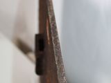 a close up of a metal object on a white surface