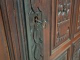 a large wooden cabinet with carvings on it