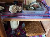 a wooden shelf with a basket of food on top of it