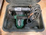 a tool in a case that is sitting on the floor