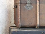two suitcases stacked on top of each other in a room