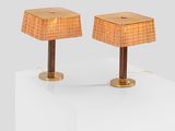 pair of table lamps with rattan lampshads on wooden bases
