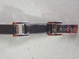 a close up of a black belt with a silver buckle