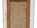 an old picture frame with a picture of a cat on it ' s side