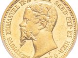 a close up of a gold coin on a white background