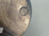 a close up of a vase with a tag on it