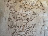 a drawing on a piece of paper with a drawing of a man on it