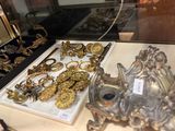 a display case with a lot of gold jewelry on it