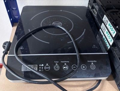 a black stove top with a black wire on it
