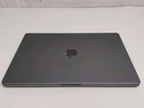 an apple macbook air laptop computer sitting on top of a white surface