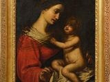 a painting of a woman holding a baby in her lap
