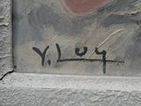 graffiti on the side of a building with writing on it