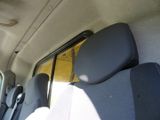 a view of the back seats of a van with the sun shining through the window