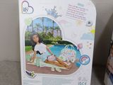 a box with a picture of a girl sitting on a blanket