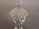a glass vase that is sitting on a table