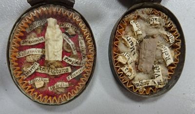 two medals that are on display on a table