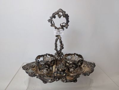 a silver plate with a candle holder on top of it