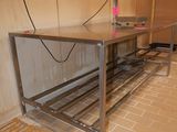 an image of a work table in the middle of a room