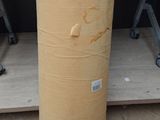 a large roll of cardboard sitting on the floor