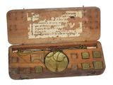 an old wooden box with a clock inside of it