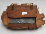 a small wooden box with a label on it