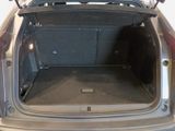 the back of a car with its trunk open and the back of the car in the back