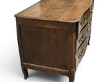 an old wooden chest of drawers sitting on top of a white floor