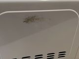a white toaster oven sitting on top of a counter