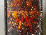 an old wooden box with a painting on it sitting on a table