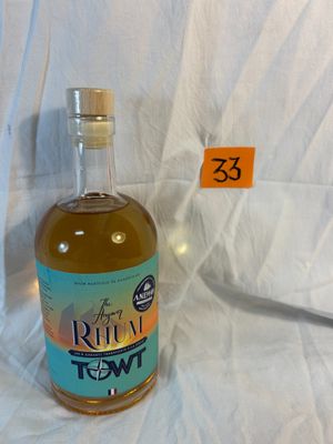 a bottle of liquor sitting on a table with a price tag