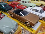 a lot of toy cars that are sitting on a table