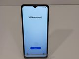 a close up of a cell phone on a table with a white background