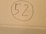 a box with a number 52 on it sitting on the floor
