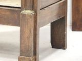 a wooden bed with a wooden headboard and foot board