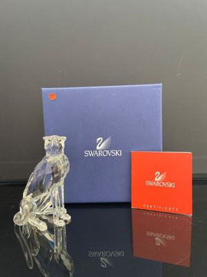 figurine en cristal Swarovski représentant un oiseau perché sur un perchoir