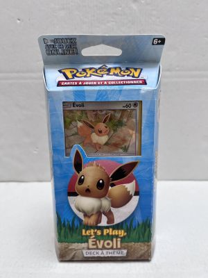 a close up of a box of pokemon cards on a table
