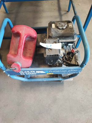 a blue cart with a red gas can and a red gas can on it