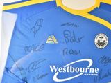 a blue and yellow shirt with a lot of writing on it