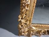 a picture of a gold frame with a mirror in it