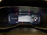 the dashboard of a car with a digital display on it