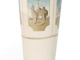 a white vase with a picture of a camel on it