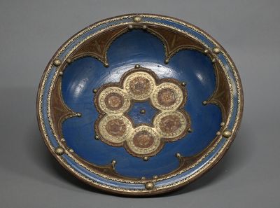 blue and brown plate with a decorative design on the outside
