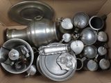 many pots and pans in a cardboard box