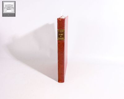 a red book sitting on top of a white table