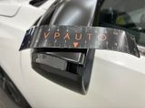 a close up of a car ' s side mirror with a sticker on it