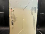 a white box that is sitting on top of a metal stand