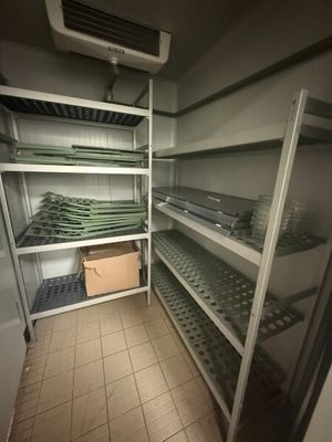 a room with a lot of shelves and shelves filled with food